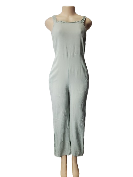 Light green jumpsuit on a mannequin against a white background