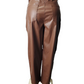 Brown leather pants on a mannequin against a white background