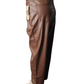 Brown leather pants on a mannequin against a white background
