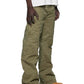 Person wearing green pants and brown shoes on a white background