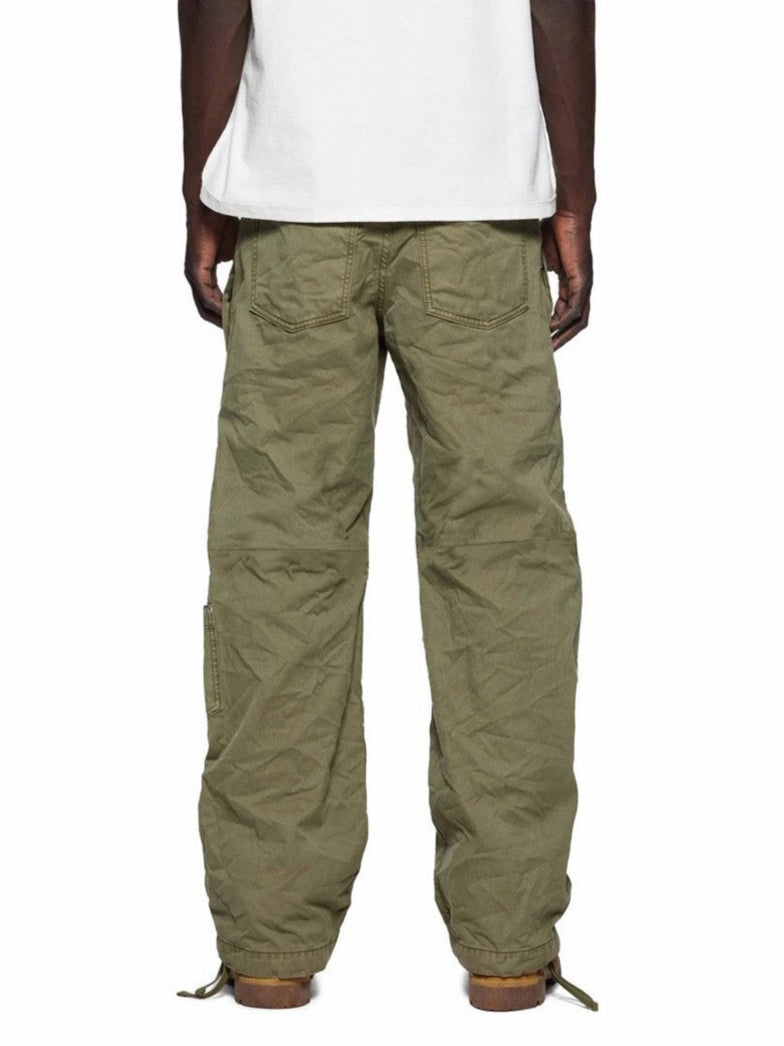 Person wearing olive green pants on a white background