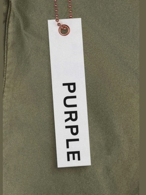 Green fabric with a white tag displaying the word 'PURPLE'.
